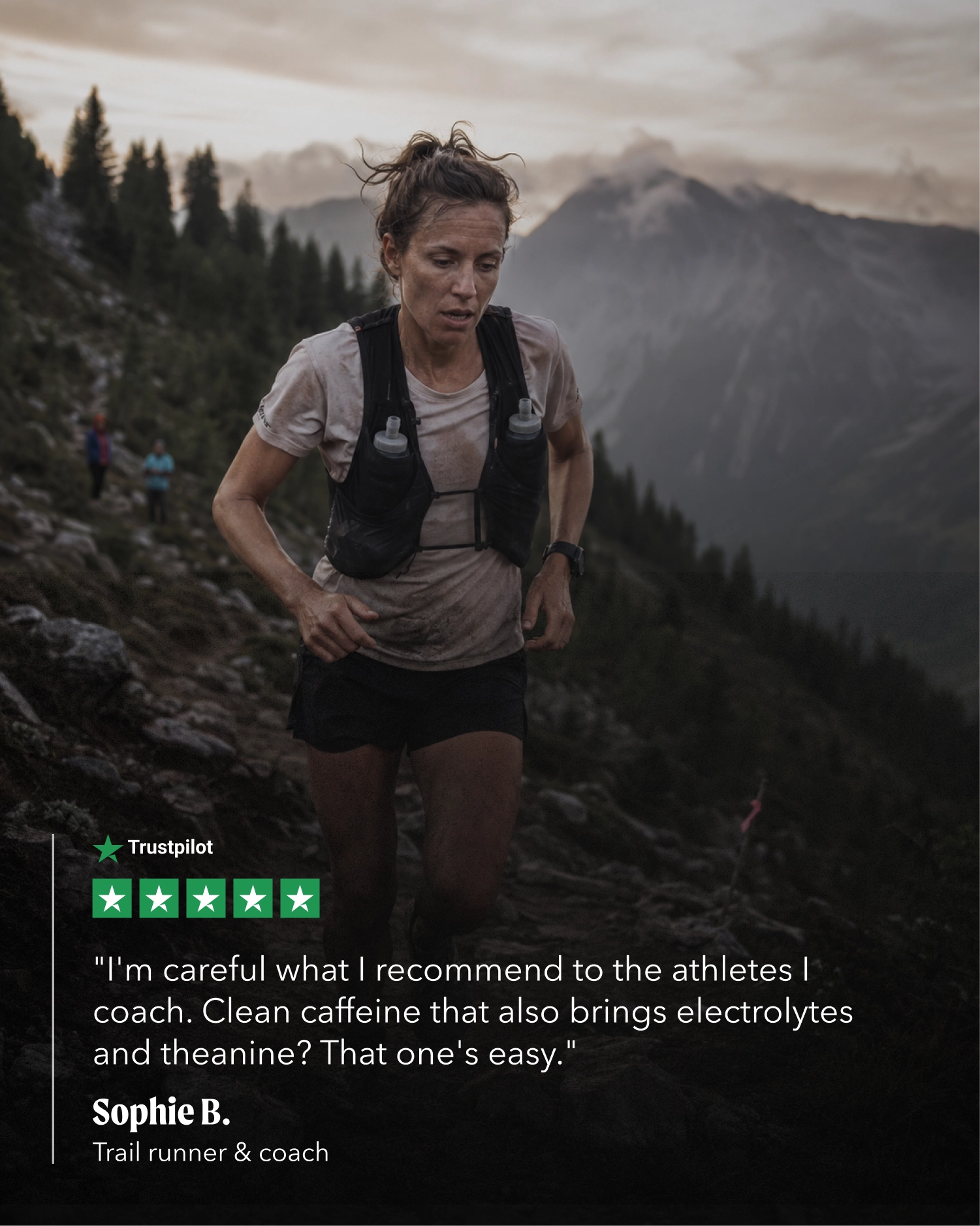 A trail runner wearing a black hydration vest and athletic gear is shown running on a rocky mountain slope with a forest and distant peaks in the background. A quote from Sophie B.
